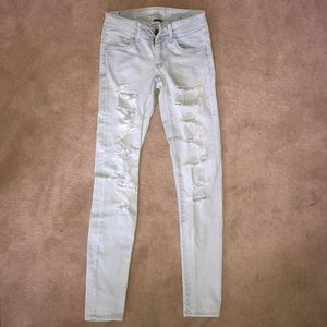 American Eagle Light Wash Super Low Rise Jeggings.